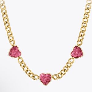 Gold necklace w/ pink hearts. Never worn.